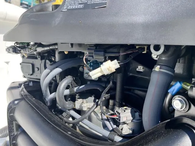 Slide: The Image of Close-up of a 2016 Sea Hunt Edge 24 engine components and wiring. - 33