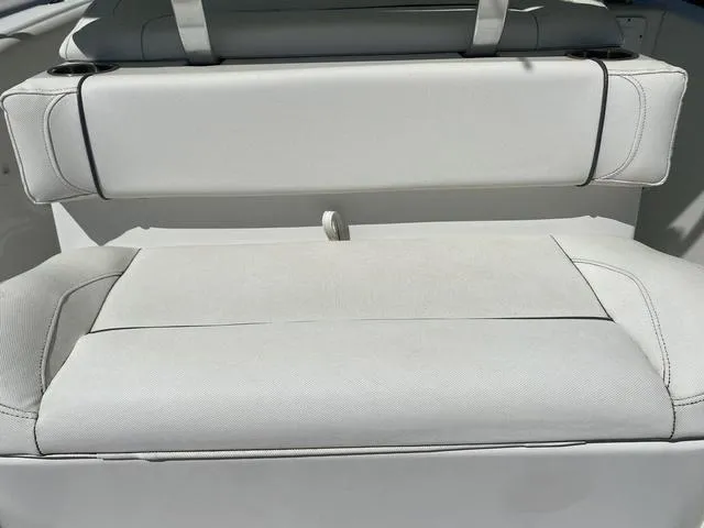 Slide: The Image of 2016 Sea Hunt Edge 24 boat seat, white upholstery, rear view. - 37