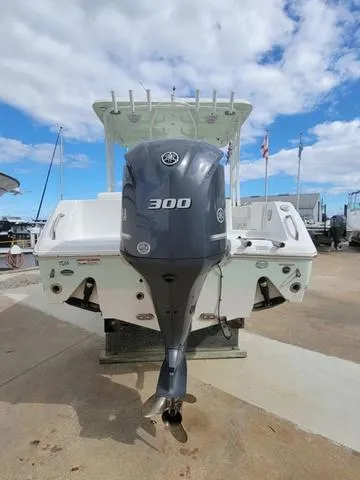Slide: The Image of 2016 Sea Hunt Edge 24 boat with Yamaha 300 outboard motor, docked under blue sky. - 5