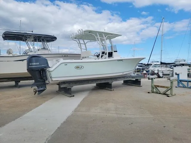 Slide: The Image of 2016 Sea Hunt Edge 24 boat on dry dock with Yamaha outboard motor. - 7