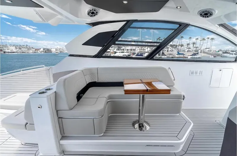 Slide: The Image of Luxurious 2025 Cruisers Yachts 50 GLS interior with elegant seating and ocean view. - 21