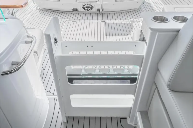 Slide: The Image of 2025 Cruisers Yachts 50 GLS deck with modern seating and sleek design. - 23