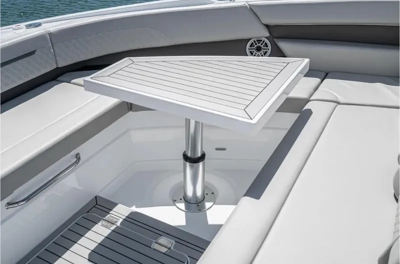 Slide: The Image of 2025 Cruisers Yachts 50 GLS interior with sleek seating and modern table design. - 49