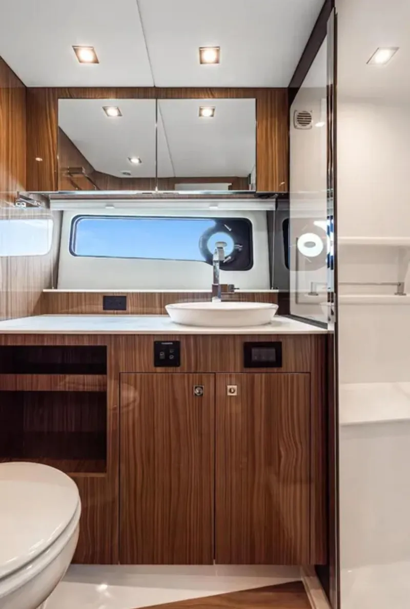 Slide: The Image of Luxurious bathroom interior of 2025 Cruisers Yachts 50 GLS with modern fixtures. - 37