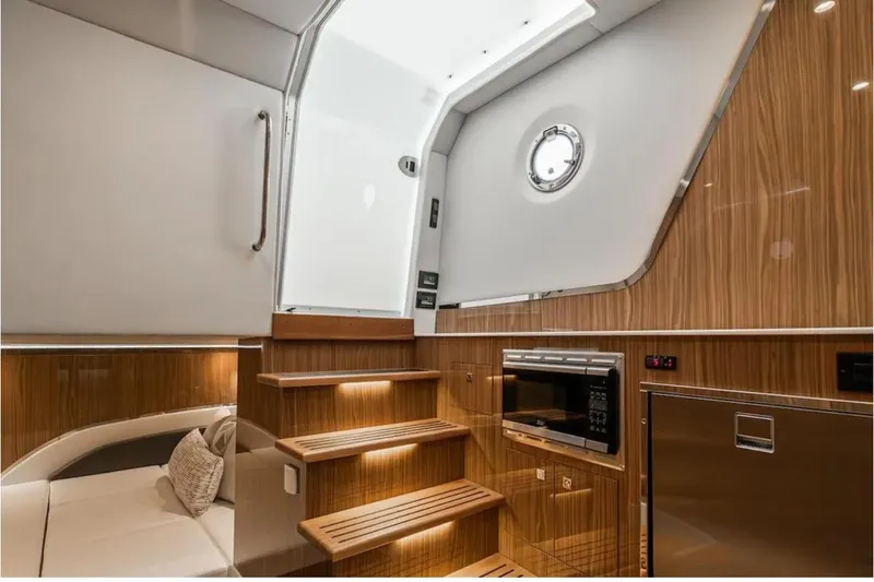 Slide: The Image of Luxurious interior of 2025 Cruisers Yachts 50 GLS with wood finish and modern amenities. - 30