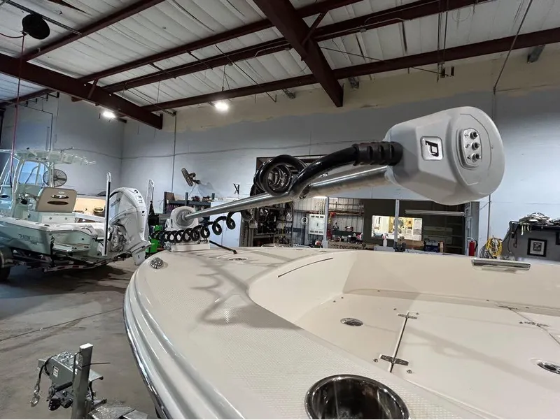 Slide: The Image of 2025 Pathfinder 2400 TRS boat in a garage, showcasing advanced trolling motor. - 10