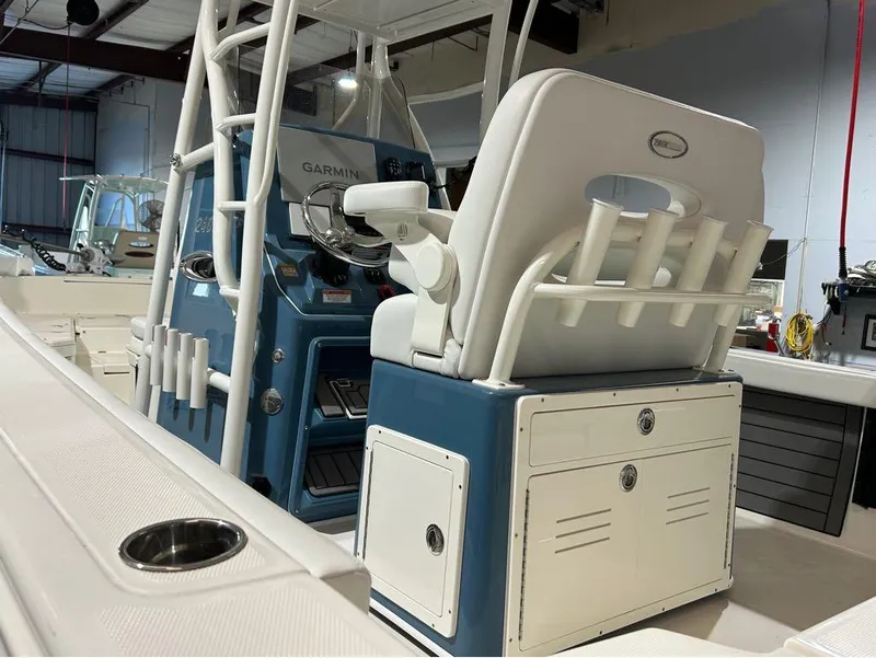 Slide: The Image of 2025 Pathfinder 2400 TRS boat interior with Garmin navigation system and seating. - 5