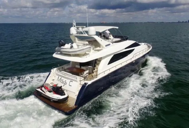 Slide: The Image of Luxury 2009 Uniesse 65 MY yacht cruising with jet ski on deck. - 0