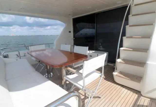 Slide: The Image of Luxury Uniesse 65 MY yacht deck with seating and ocean view, 2009 model. - 5