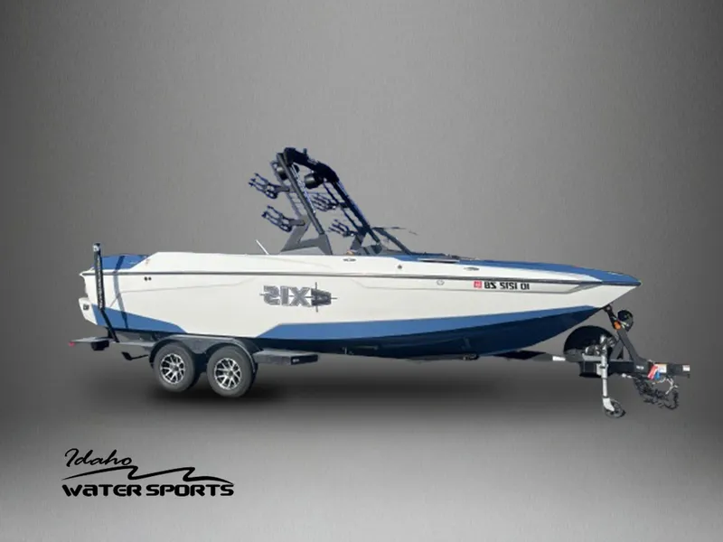 Slide: The Image of 2022 Axis Wake Research A24 boat on trailer, Idaho Water Sports logo. - 1
