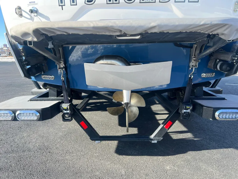 Slide: The Image of 2022 Axis Wake Research A24 boat stern with propeller and trailer. - 24