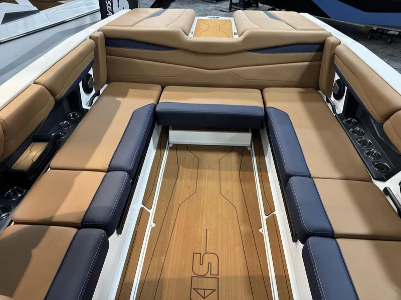 Slide: The Image of Luxurious interior of 2025 Axis A245 boat with tan and navy seating. - 13