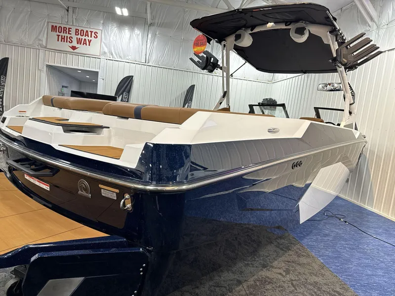 Slide: The Image of 2025 Axis A245 boat in showroom, featuring sleek design and spacious seating. - 5