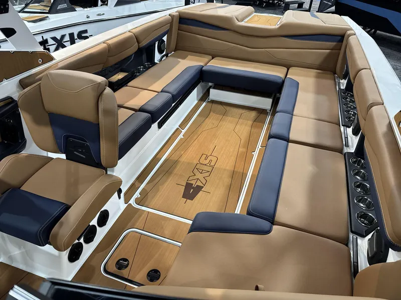 Slide: The Image of Luxurious interior of 2025 Axis A245 boat with tan and navy seating. - 9