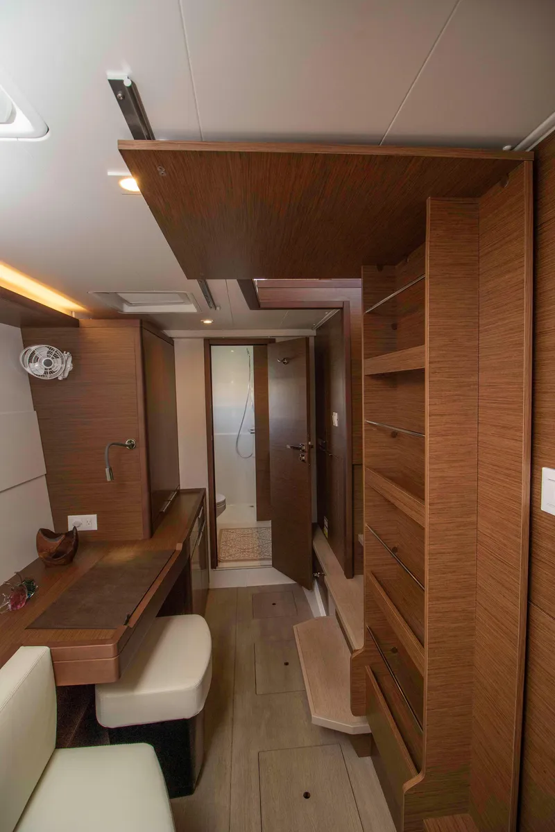 Slide: The Image of Interior of 2019 Lagoon 40 yacht, featuring wooden cabinetry and modern design. - 18
