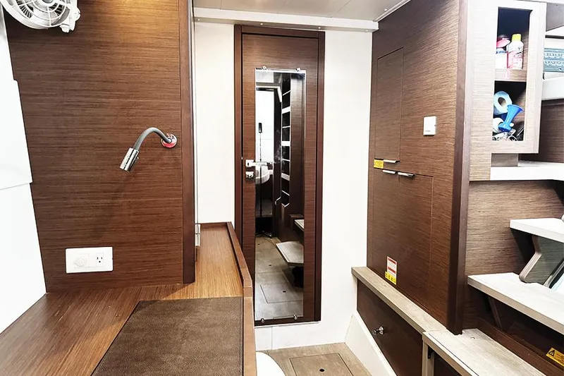 Slide: The Image of Interior of 2019 Lagoon 40 yacht with wooden finish and modern amenities. - 19