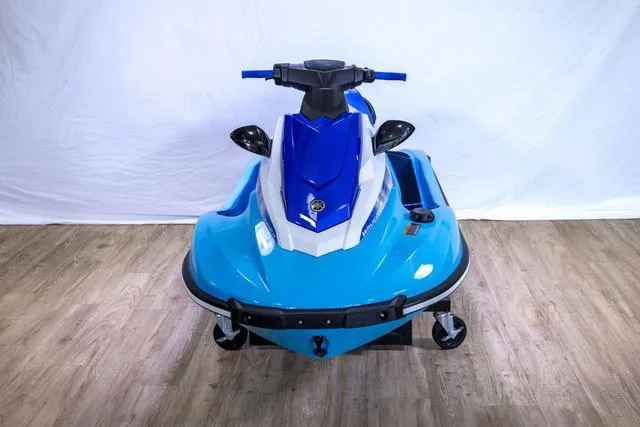 Slide: The Image of 2024 Yamaha Waverunner EX® Sport, blue and white jet ski on display indoors. - 10