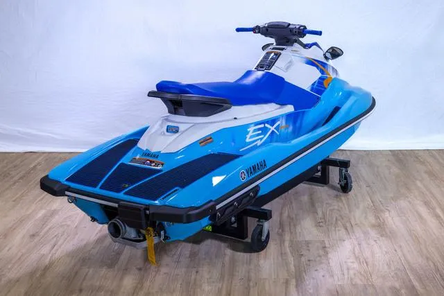 Slide: The Image of 2024 Yamaha Waverunner EX® Sport in blue, displayed indoors on a wooden floor. - 11