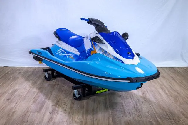 Slide: The Image of 2024 Yamaha Waverunner EX® Sport in blue on display indoors. - 3