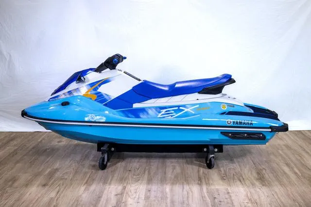 Slide: The Image of 2024 Yamaha Waverunner EX® Sport in blue and white on display. - 4