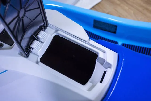 Slide: The Image of 2024 Yamaha Waverunner EX® Sport storage compartment, open lid, blue and white design. - 6