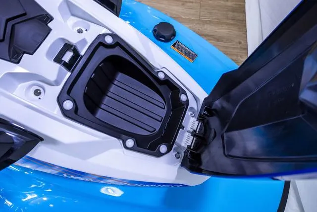 Slide: The Image of 2024 Yamaha Waverunner EX® Sport storage compartment, open view, blue and white design. - 8
