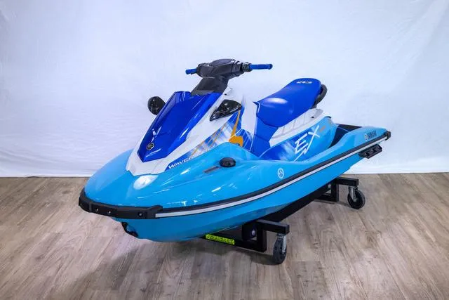 Slide: The Image of 2024 Yamaha Waverunner EX® Sport in blue on display indoors. - 9