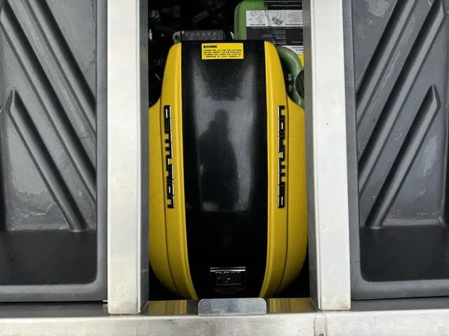 Slide: The Image of 2022 Centurion Ri245 engine compartment with yellow and black cover. - 13