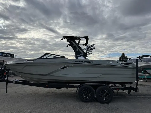 Slide: The Image of 2022 Centurion Ri245 boat on trailer under cloudy sky. - 4
