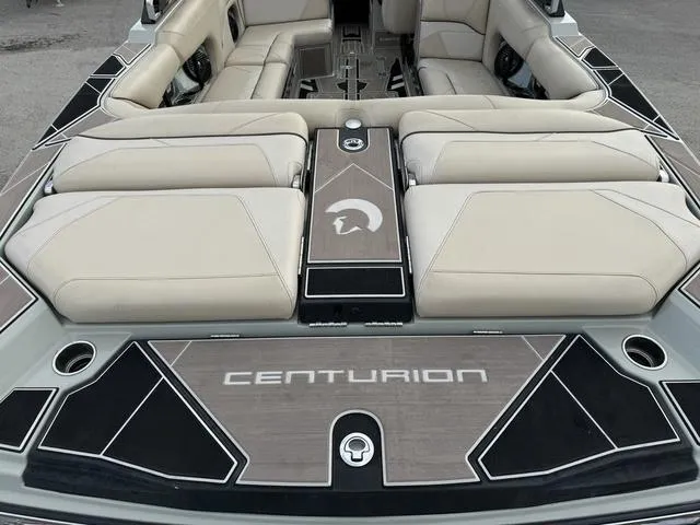 Slide: The Image of 2022 Centurion Ri245 boat interior with beige seating and sleek design. - 6
