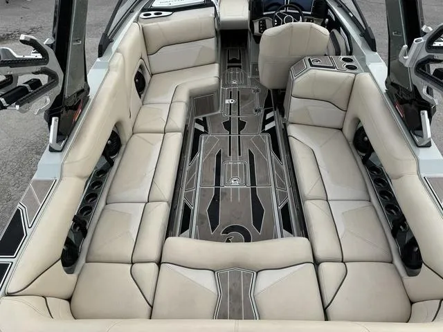 Slide: The Image of 2022 Centurion Ri245 boat interior with luxurious seating and modern design. - 8