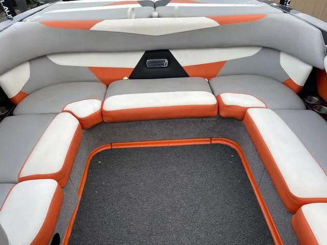 Slide: The Image of 2016 Malibu 22 VLX boat interior with orange and gray seating. - 14
