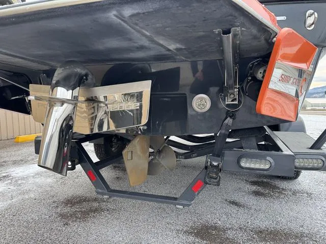 Slide: The Image of 2016 Malibu 22 VLX boat stern with propeller and surf gate system. - 18