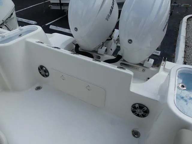 Slide: The Image of 2025 Key West 244 CC boat with dual Yamaha engines and deck speakers. - 10