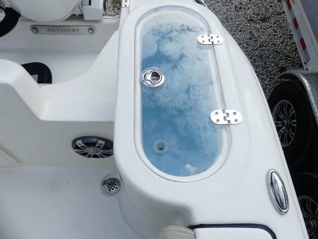 Slide: The Image of 2025 Key West 244 CC boat with livewell and speaker on deck. - 11