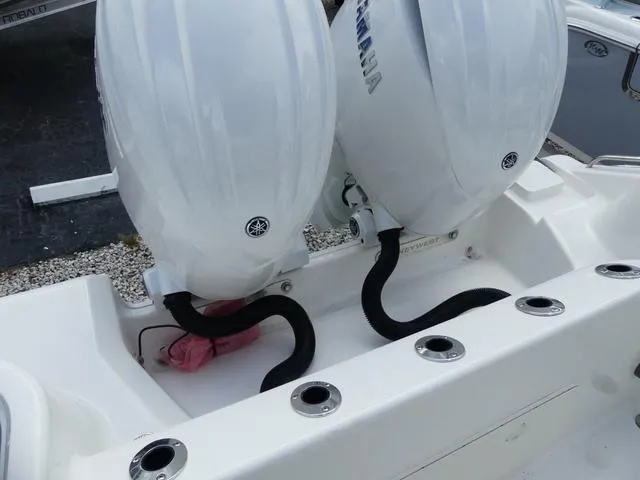 Slide: The Image of 2025 Key West 244 CC boat with dual Yamaha outboard engines. - 13