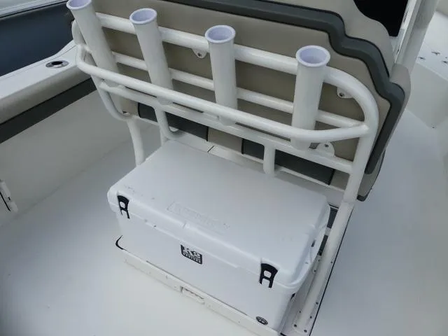 Slide: The Image of 2025 Key West 244 CC boat with rod holders and cooler storage. - 14
