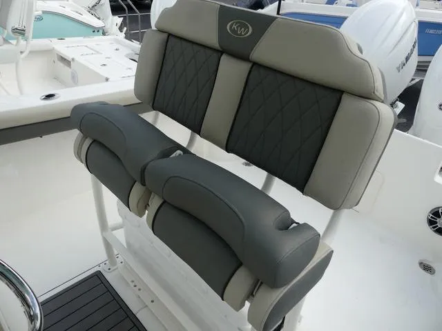 Slide: The Image of 2025 Key West 244 CC boat seating with cushioned backrests and armrests. - 20