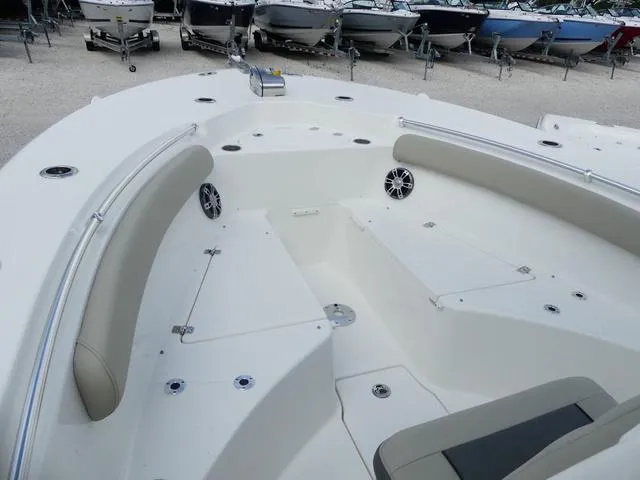 Slide: The Image of 2025 Key West 244 CC boat interior with seating and storage compartments. - 23