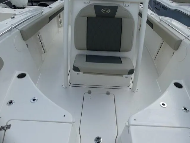 Slide: The Image of 2025 Key West 244 CC boat interior with seating and storage compartments. - 25