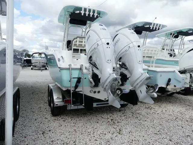 Slide: The Image of 2025 Key West 244 CC boat with dual Yamaha engines on a trailer. - 5
