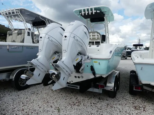 Slide: The Image of 2025 Key West 244 CC boat with dual outboard engines on a trailer. - 7