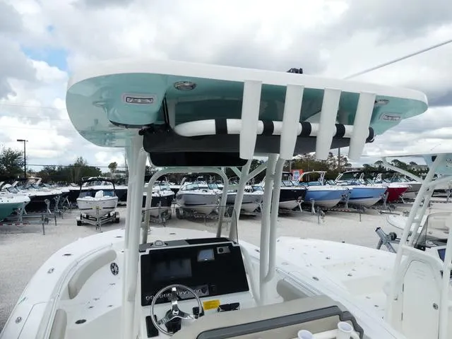Slide: The Image of 2025 Key West 244 CC boat with modern console and T-top in a marina. - 9