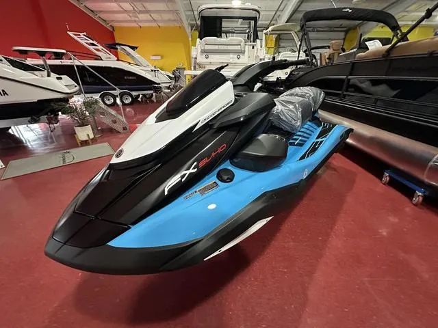 Slide: The Image of 2025 Yamaha WaveRunner FX SVHO in showroom, black and blue design. - 2