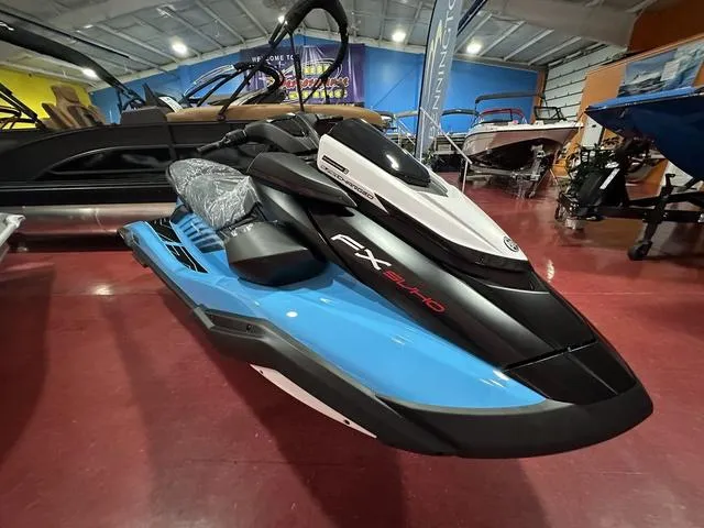 Slide: The Image of 2025 Yamaha WaveRunner FX SVHO in showroom, sleek blue and black design. - 3