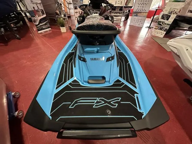 Slide: The Image of 2025 Yamaha WaveRunner FX SVHO in showroom, rear view, blue and black design. - 6