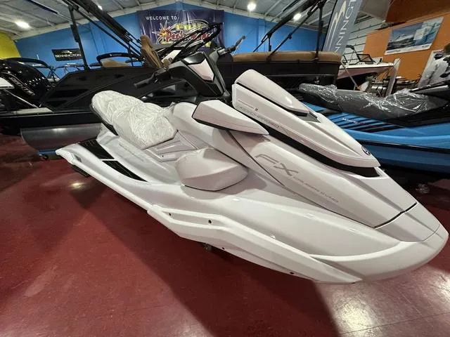 Slide: The Image of 2025 Yamaha WaveRunner FX Cruiser SVHO in showroom, sleek white design. - 4