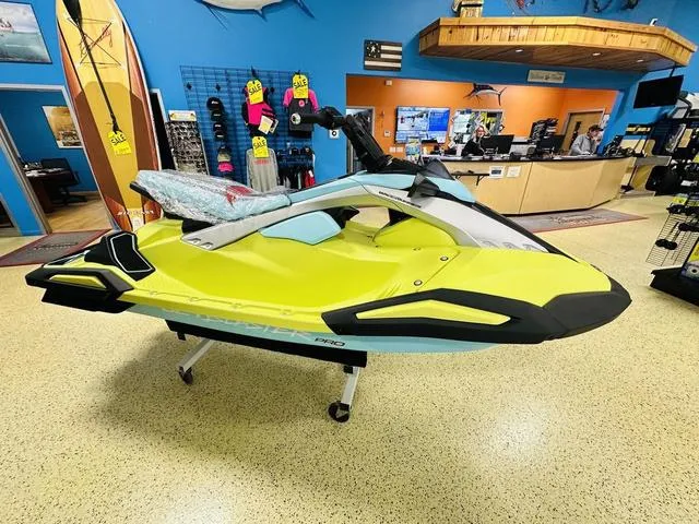Slide: The Image of 2025 Yamaha WaveRunner JetBlaster in showroom, vibrant yellow and black design. - 3