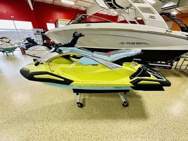 Slide: The Image of 2025 Yamaha WaveRunner JetBlaster in showroom, vibrant yellow and blue design. - 4