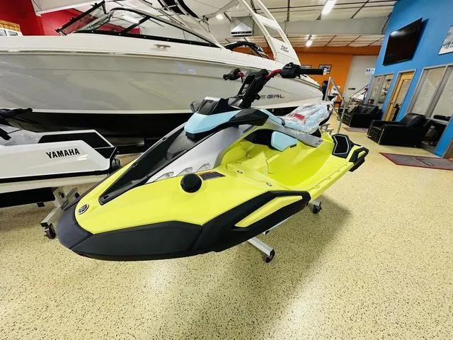 Slide: The Image of 2025 Yamaha WaveRunner JetBlaster in showroom, vibrant yellow and black design. - 5